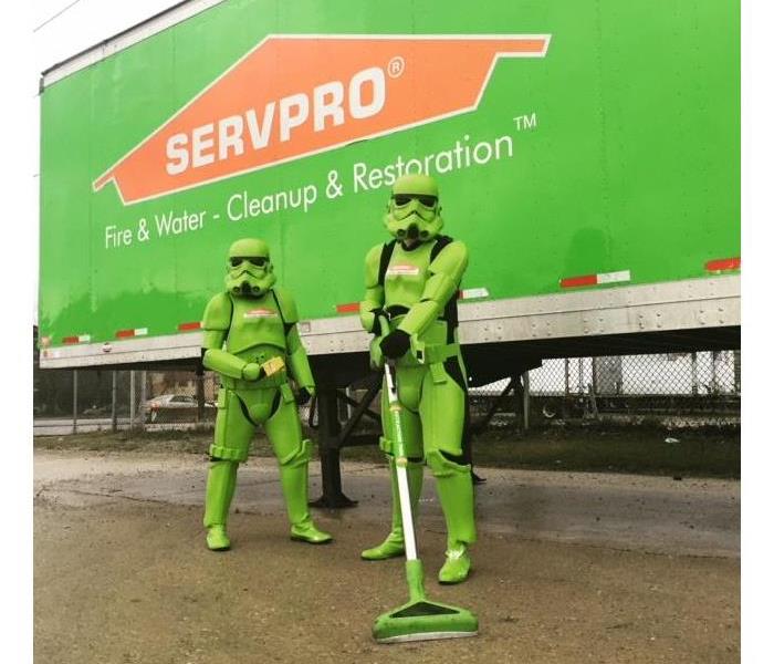 two SERVPRO employees dresses up as green storm troopers