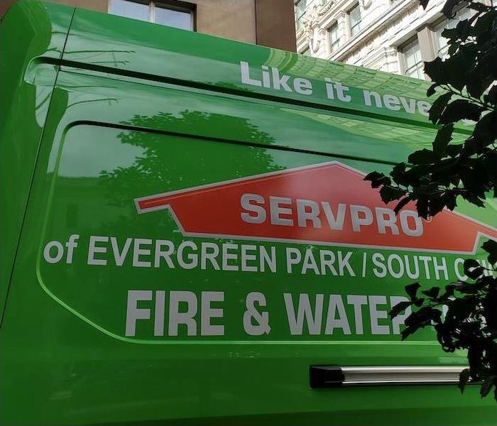The side of a green SERVPRO van