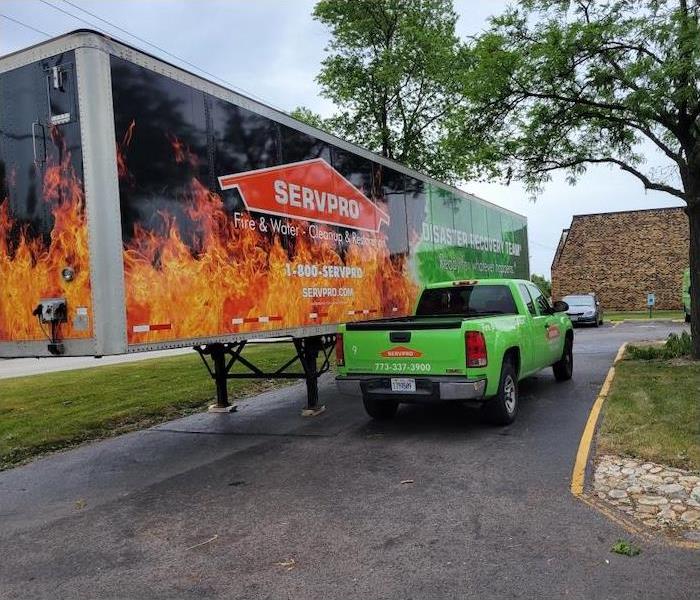 SERVPRO trailer and SERVPRO truck in a driveway